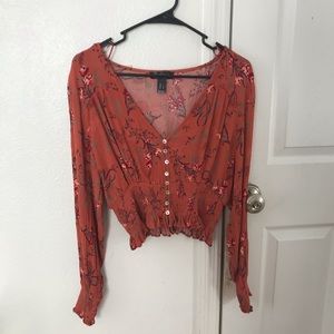 Burnt orange blouse with floral pattern